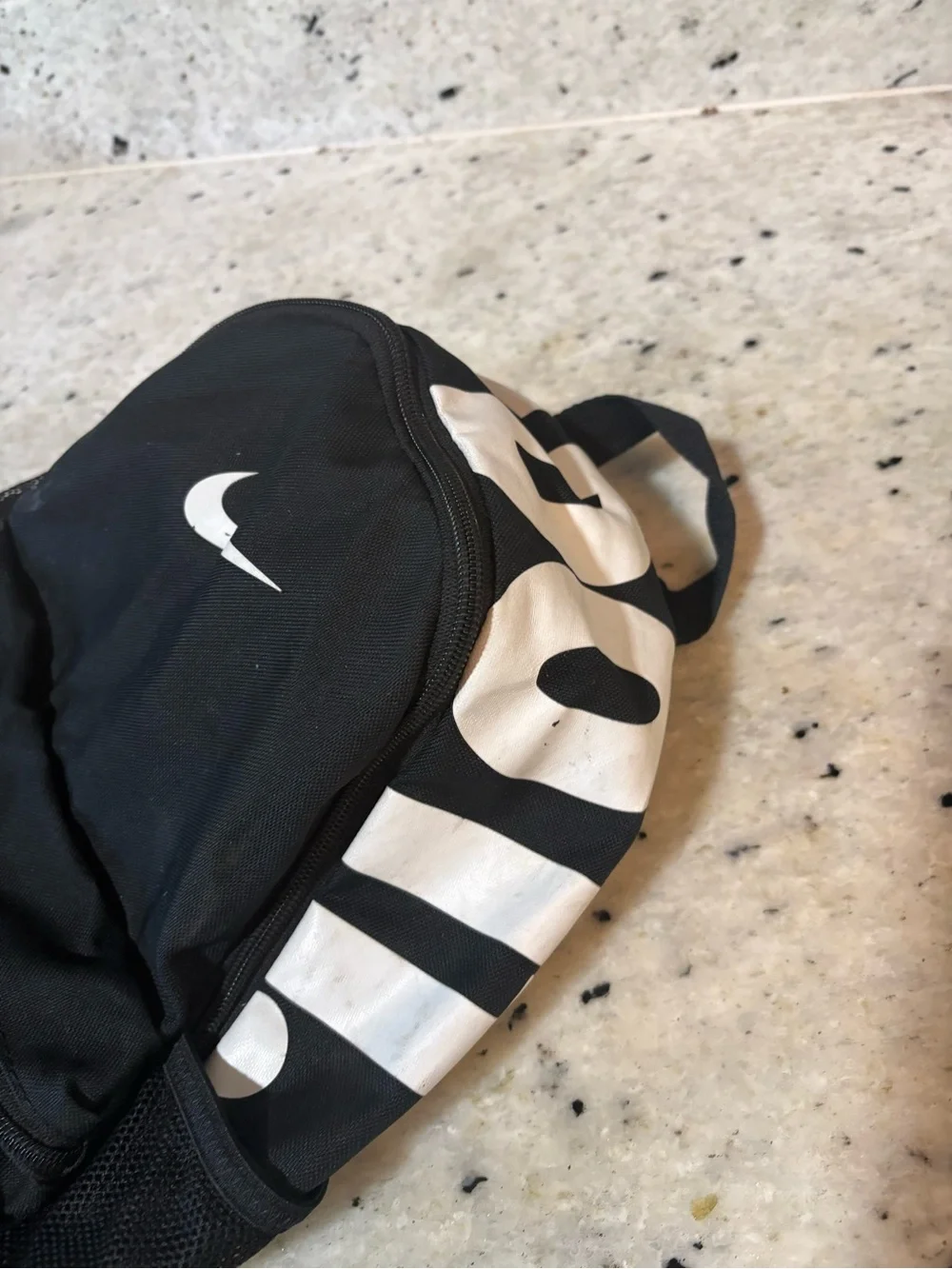 Nike Black and White Mini Backpack with Swoosh Accent